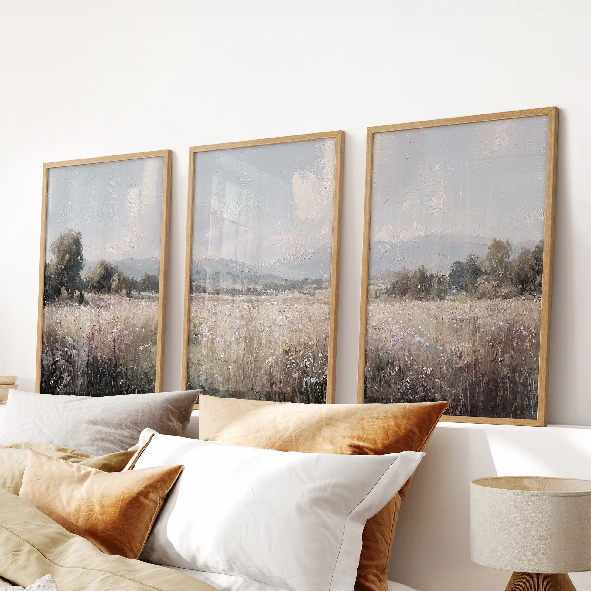 Countryside painting, a three-piece wall art set in oak frames, hang above the bed to add calm texture to the bedroom.
