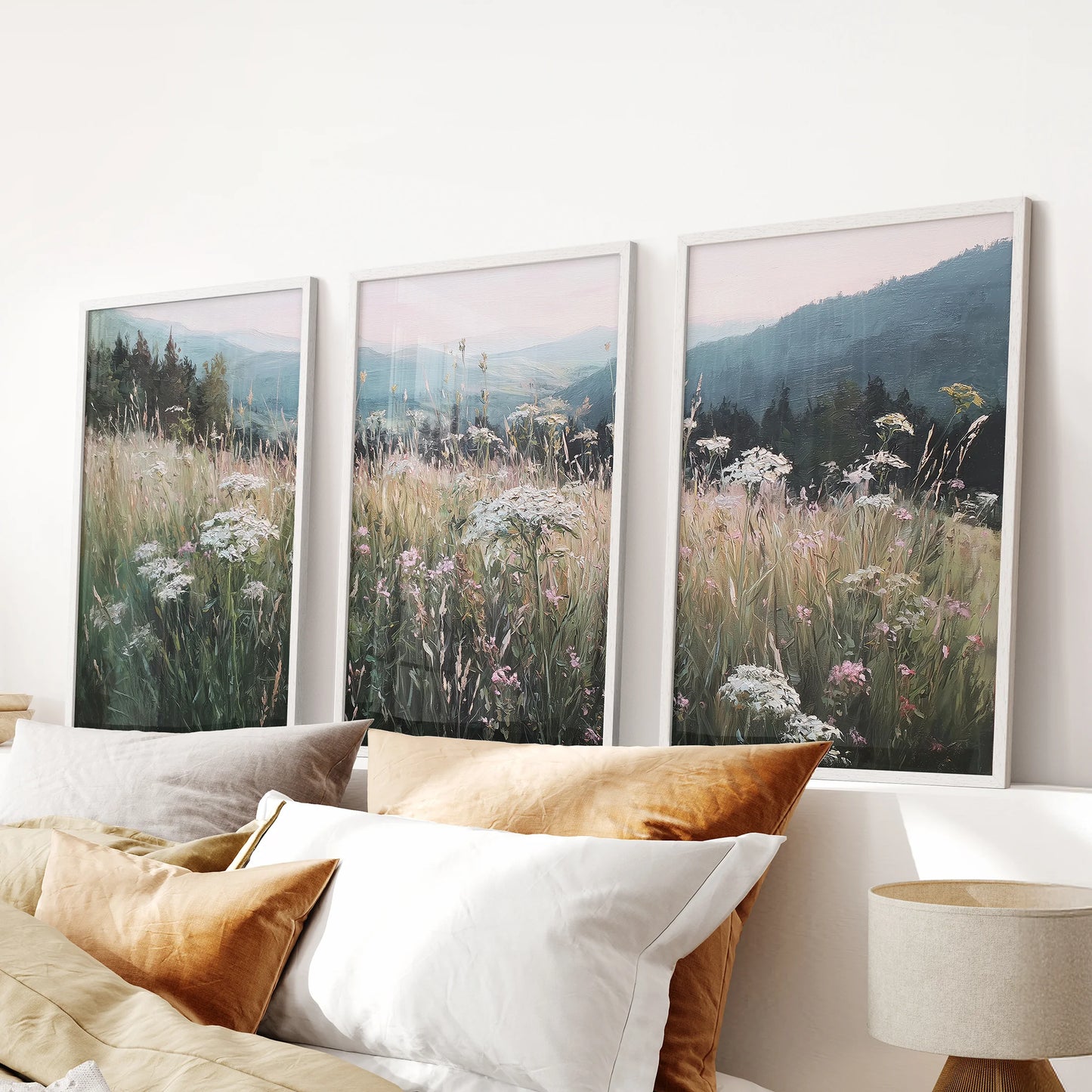 Moody neutral meadow scene 3 piece artwork set, white framed wall art, sits softly above the bed in the bedroom for a quiet, pastoral look.