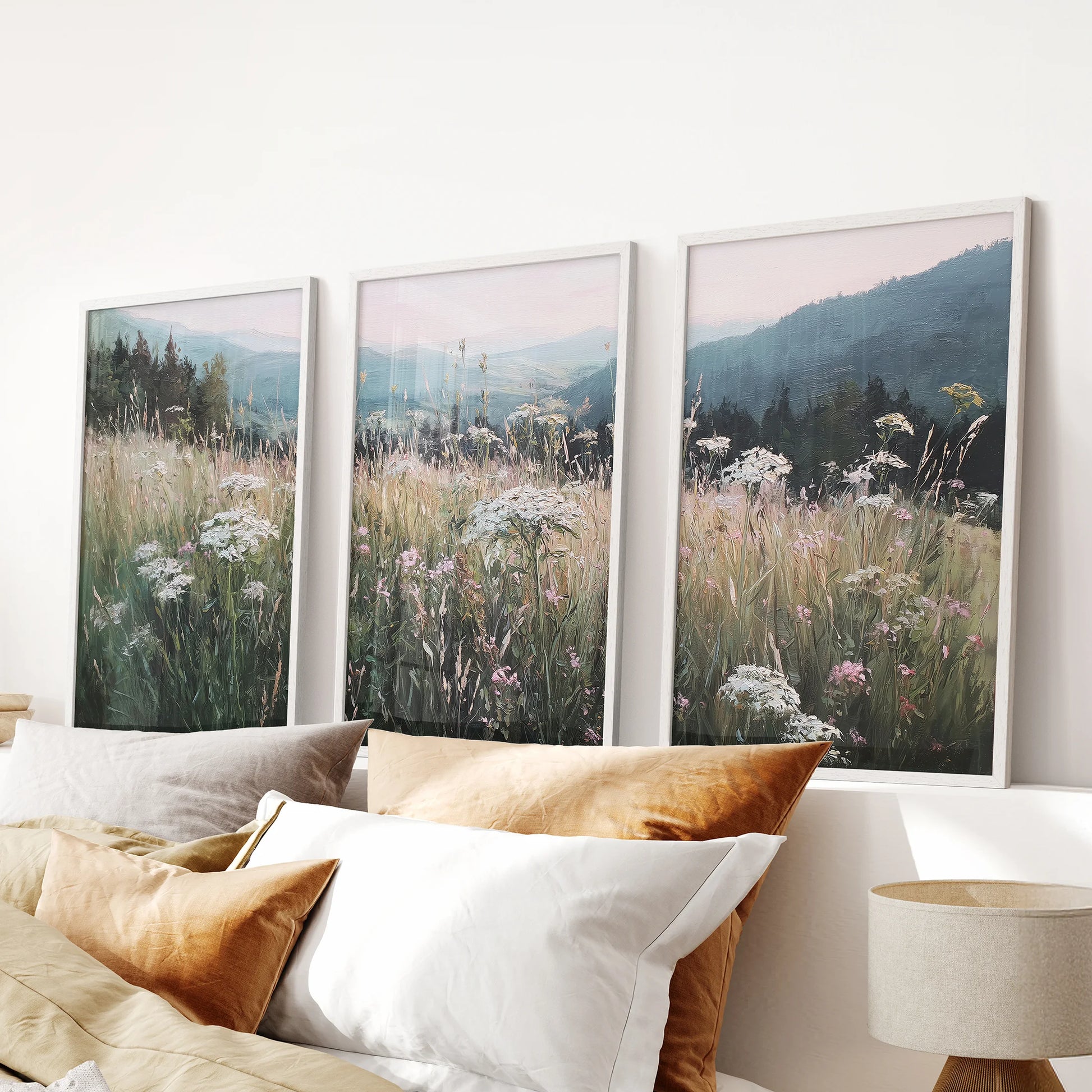 Moody neutral meadow scene 3 piece artwork set, white framed wall art, sits softly above the bed in the bedroom for a quiet, pastoral look.