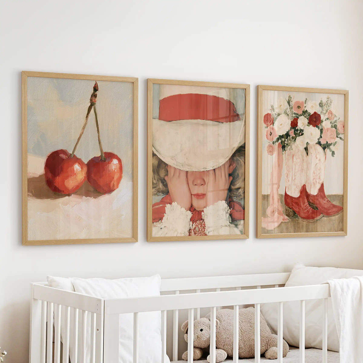 Floral cowgirl boots gallery wall set of 3 in natural wood framed prints brings whimsy to the baby nursery, floating over the cot.