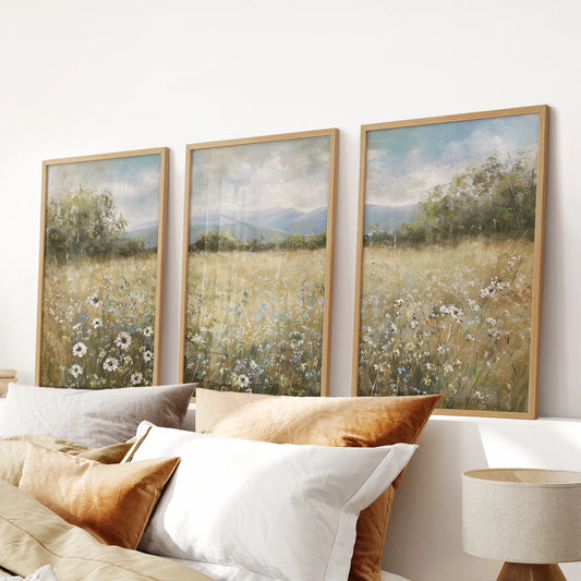 Neutral wildflower meadow three-print set for the wall in light oak frames, ideal above the bedroom headboard for a soft, vintage touch.
