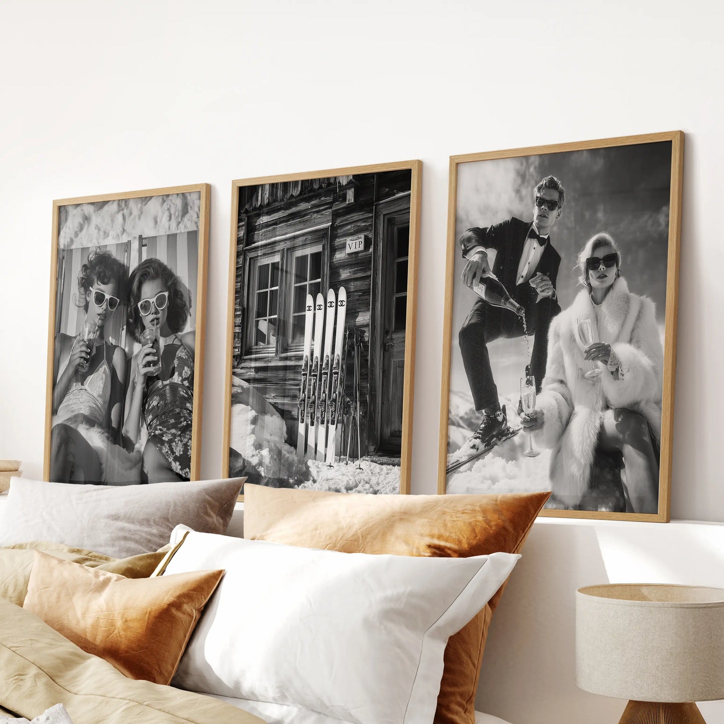 Winter cabin lounge bar, a set of three wall prints in warm wooden frames, rests above the bed's headboard to infuse the bedroom with nostalgic alpine mood.