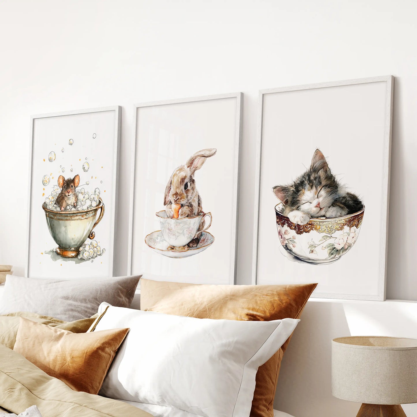 Sets of three white-framed wall prints of mice in teacups span the bedroom wall above the bed, creating a gentle vintage watercolor focus.
