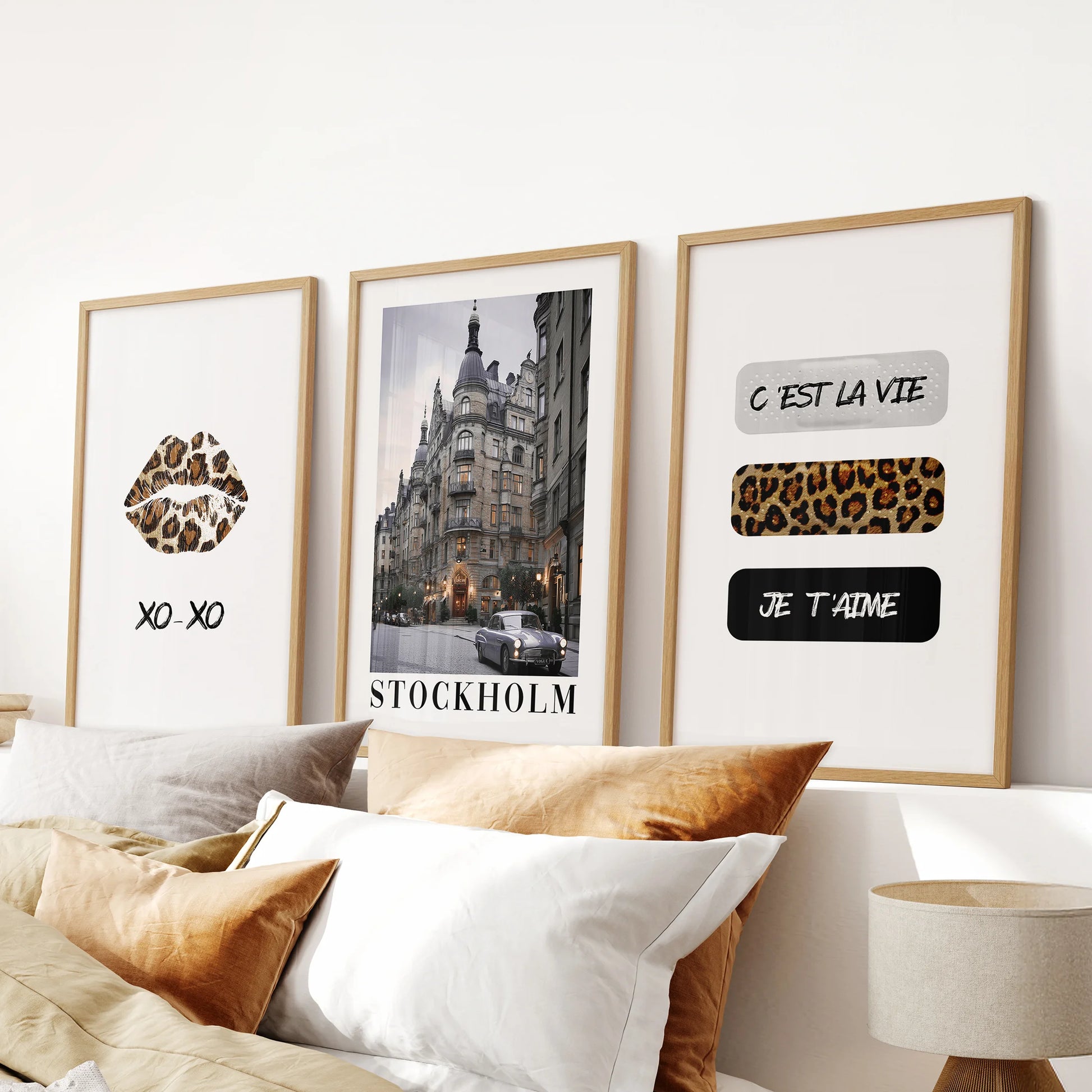 Vogue-inspired fashion prints, a trio, style the bedroom above the headboard with gallery charm, showcased in warm oak frames for soft contrast.
