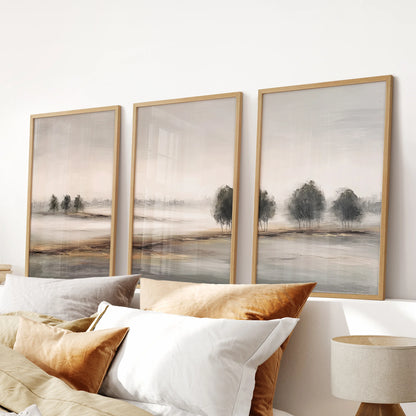 Farmhouse country landscape set, a 3-piece print suite in light wood frames, hangs above the headboard to warm the bedroom with sunlit neutral fields.