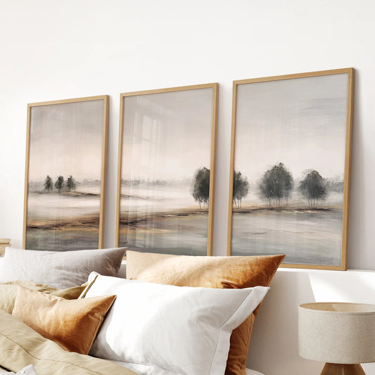 Farmhouse country landscape set, a 3-piece print suite in light wood frames, hangs above the headboard to warm the bedroom with sunlit neutral fields.