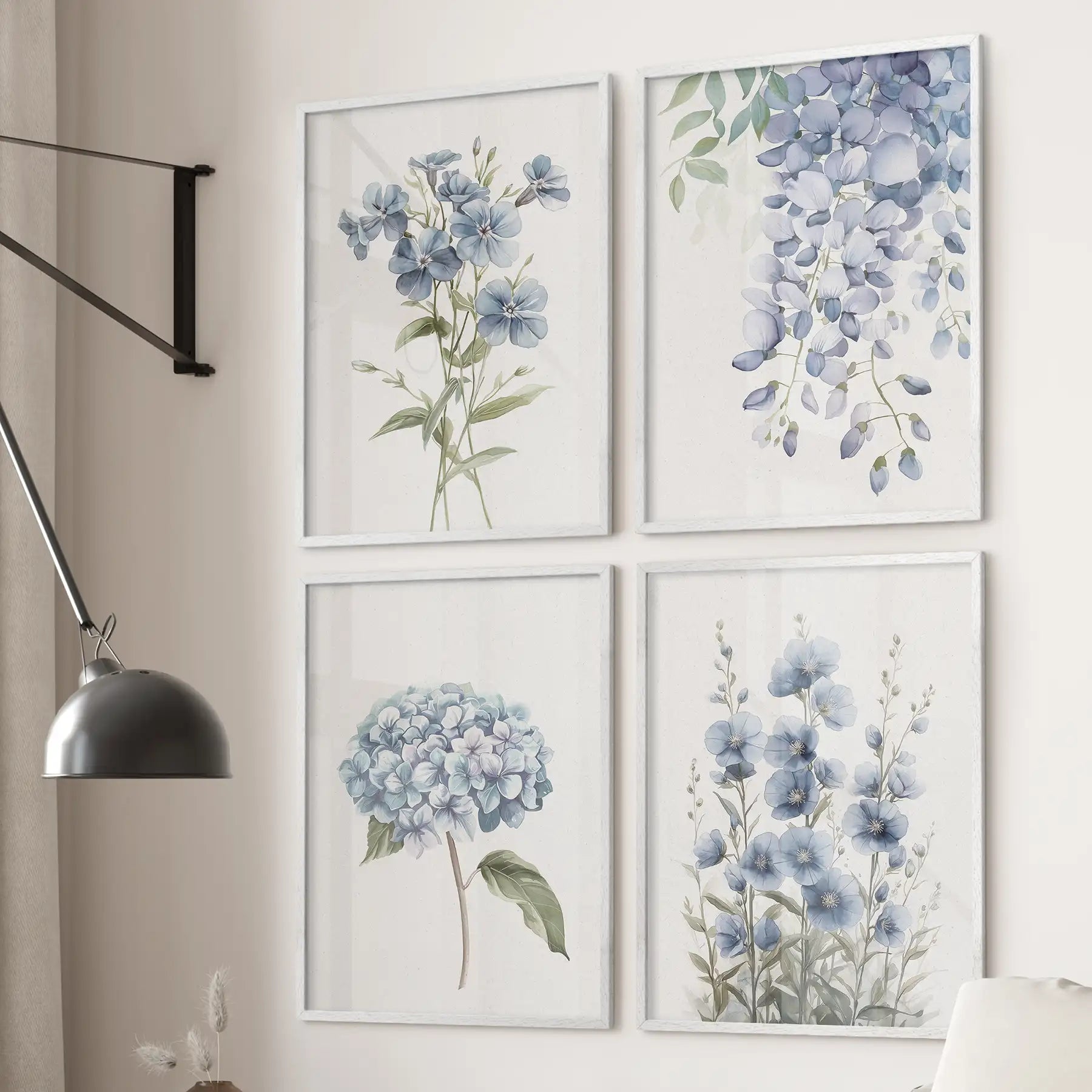 Set of 4 blue botanical wall art prints with hydrangea, flax, and wisteria flowers. White frames over the couch.