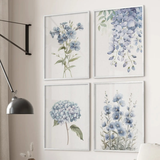 Set of 4 blue botanical wall art prints with hydrangea, flax, and wisteria flowers. White frames over the couch.