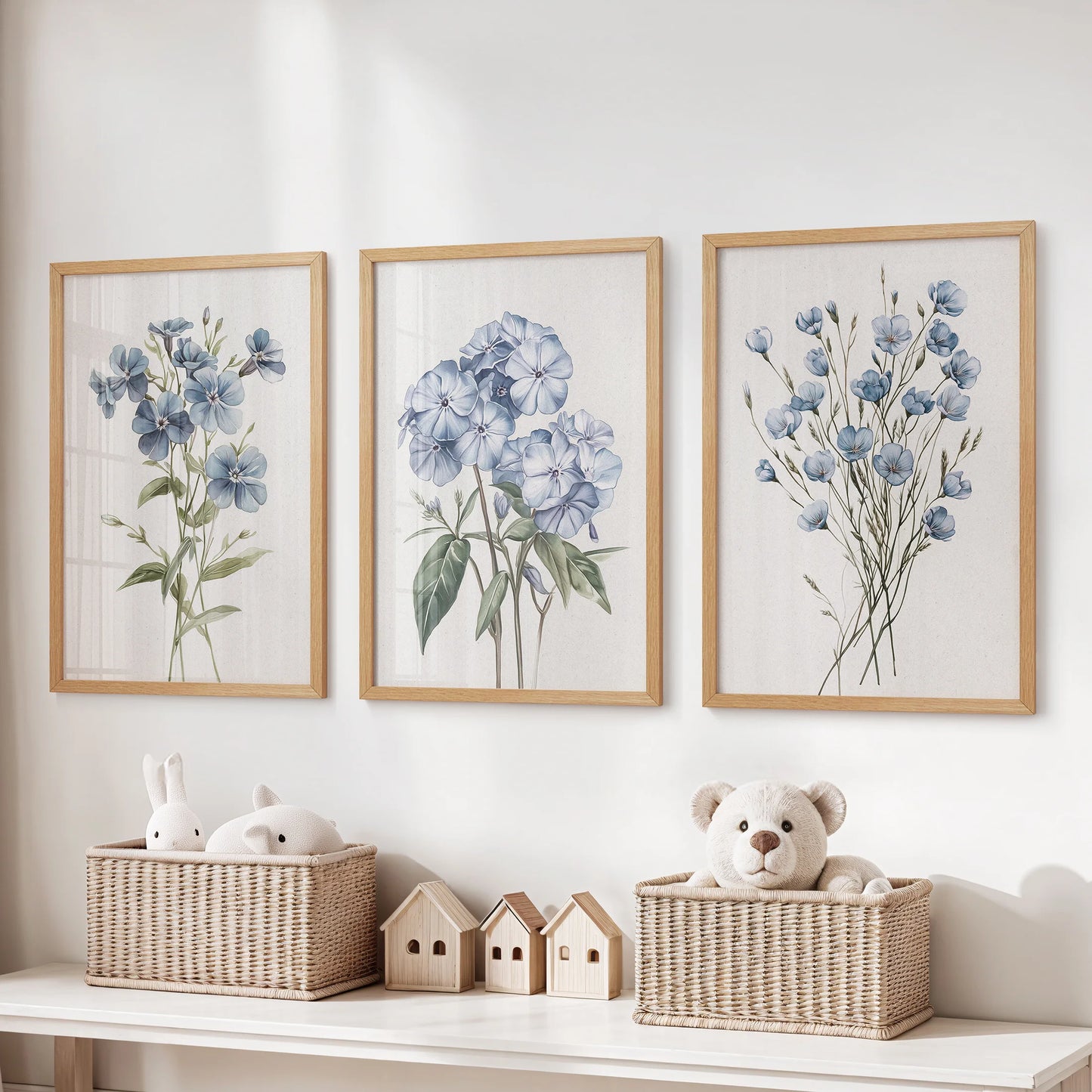 Light blue floral botanical prints, a 3-piece poster set in natural wood frames, hang over the toy storage bench to bring gentle color to the kids room.