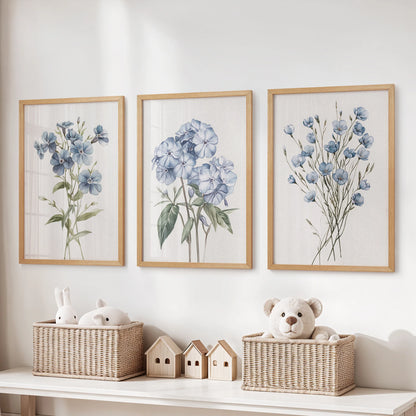 Light blue floral botanical prints, a 3-piece poster set in natural wood frames, hang over the toy storage bench to bring gentle color to the kids room.
