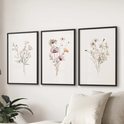 Meadow watercolor blooms wall art, a trio of prints in black frames, floats above the couch to freshen the sitting room with airy color.