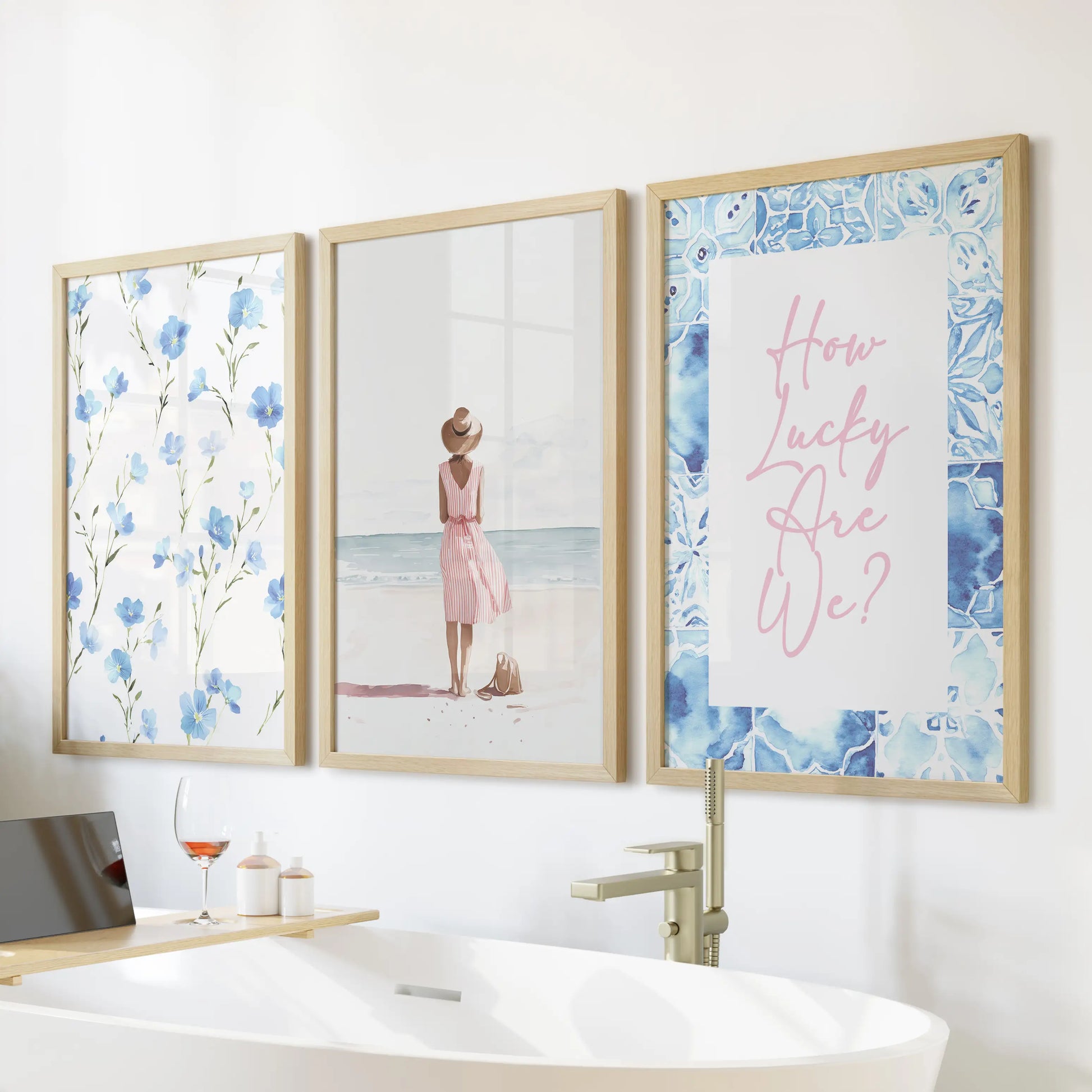 Mounted above the tub, this three-print wall art set of beach girls illustrations in warm wood frames brings playful coastal whimsy to the bathroom.