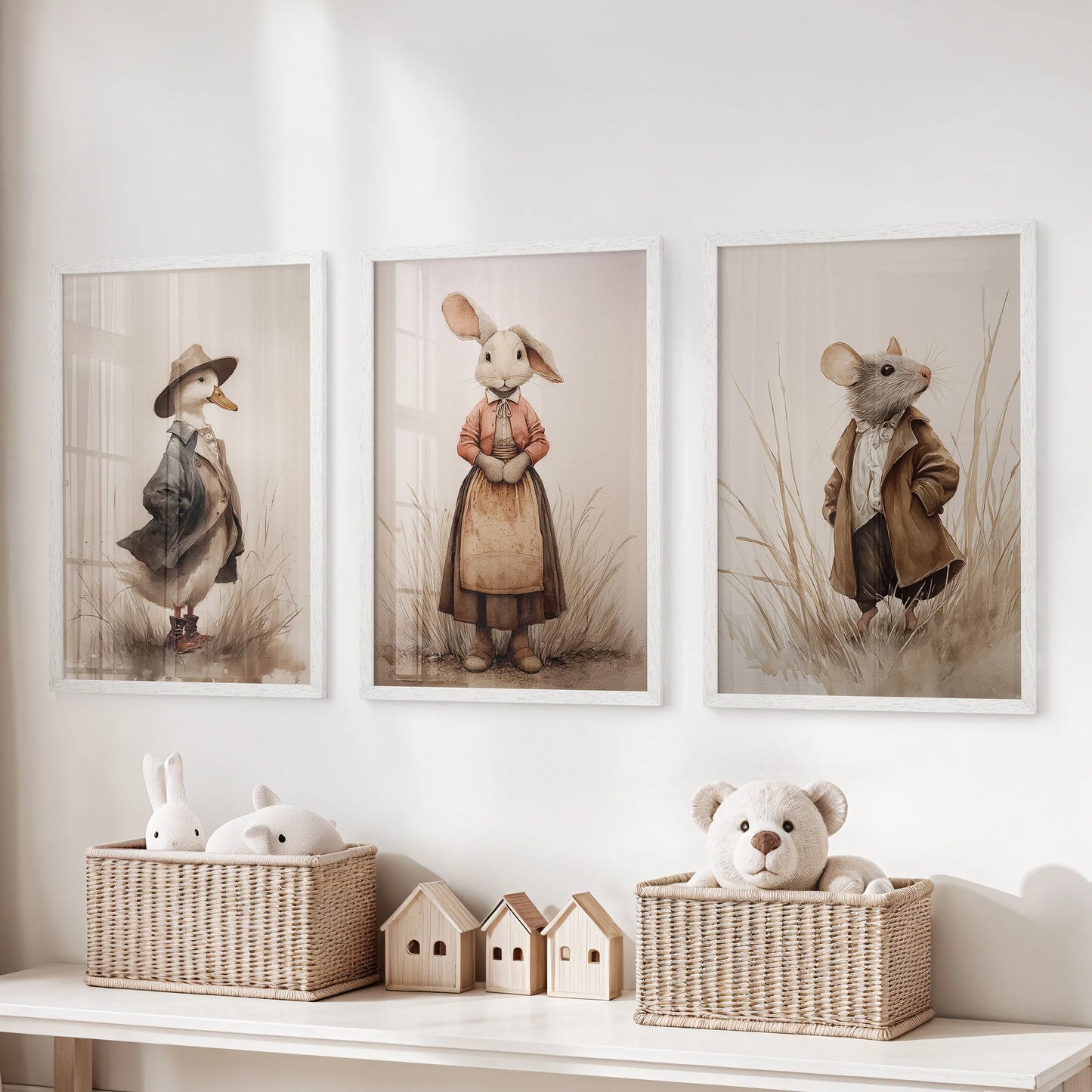 Neutral beige nursery animal prints, a three-piece wall set in white frames, brighten a kids playroom and hang neatly over toy storage for a tidy, playful look.