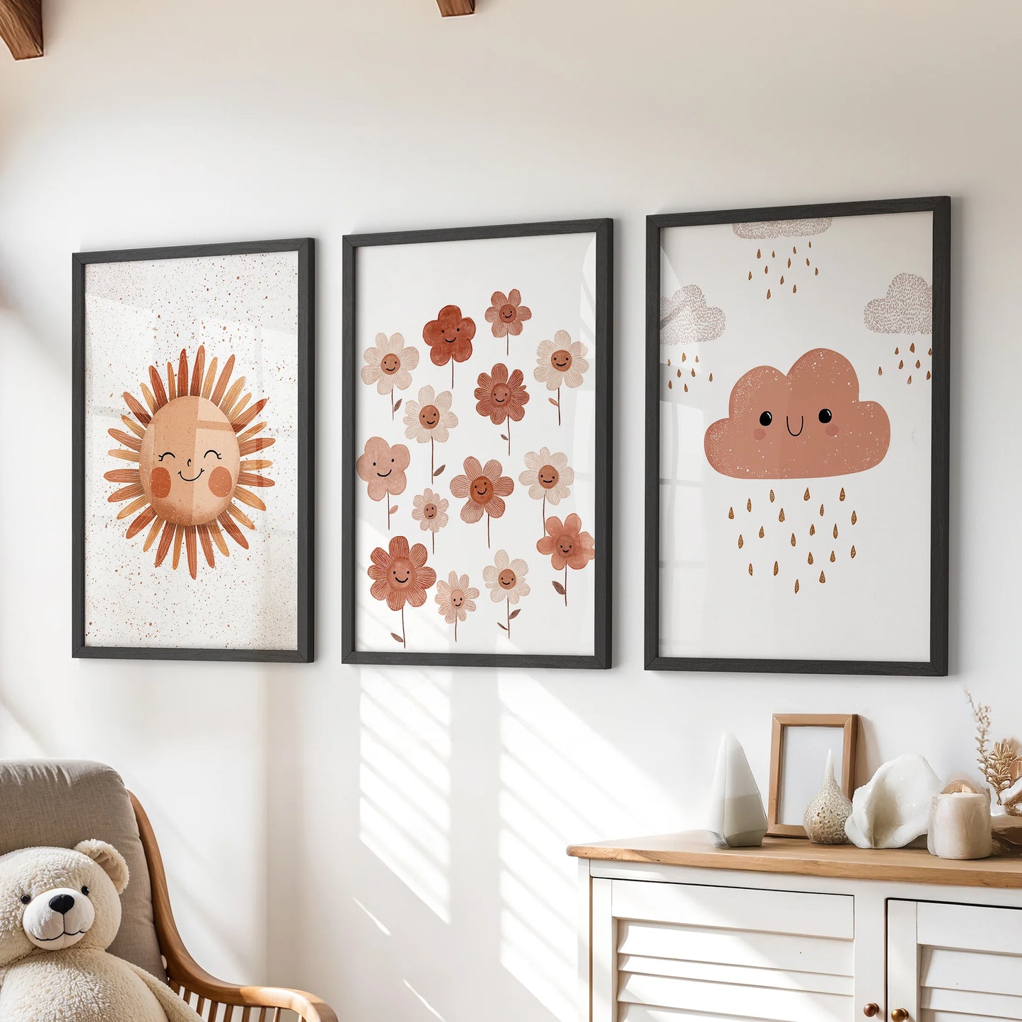 Sun and cloud illustrations, a gallery set of three wall art prints in black frames, styled over the playroom dresser for a cheerful focal point.