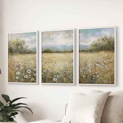 Pastoral countryside landscape neutral painting trio of posters with matte white frames, a calm focal point for the sitting room wall above the sectional.