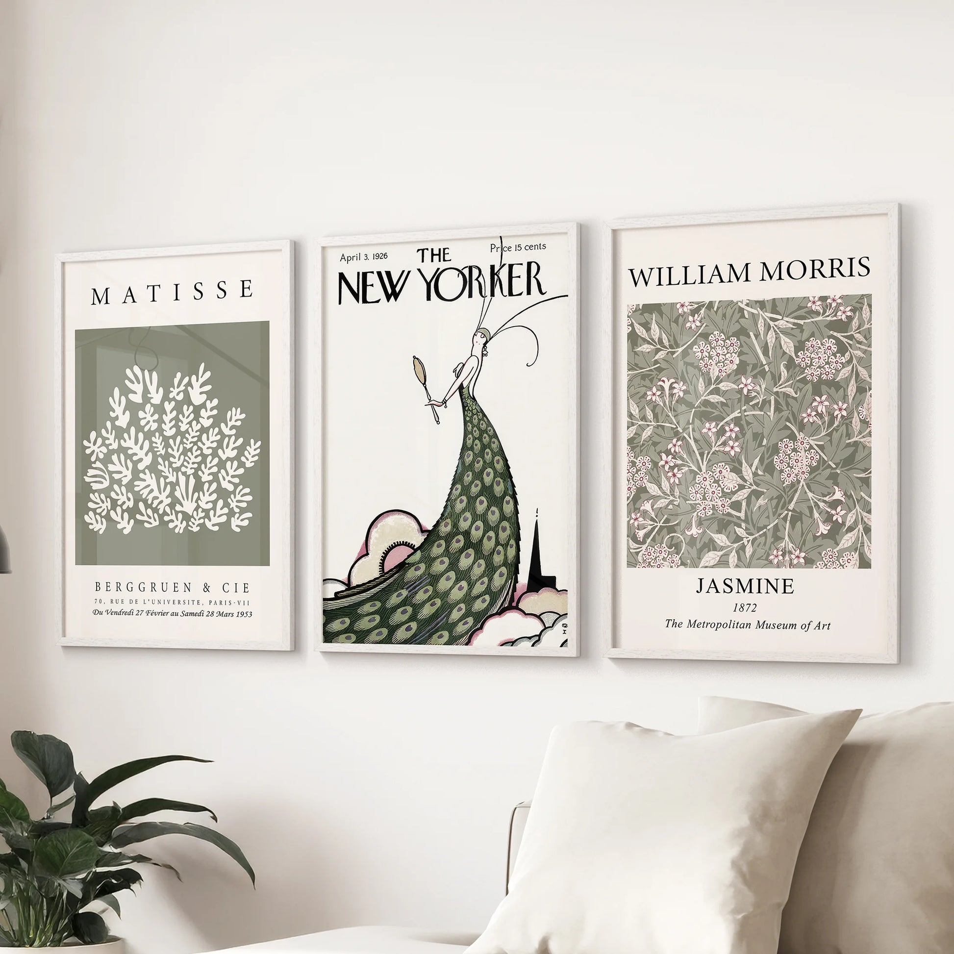 Soft pink and green 3-piece art in white-framed prints lends coordinated charm to a living room display over the sectional.