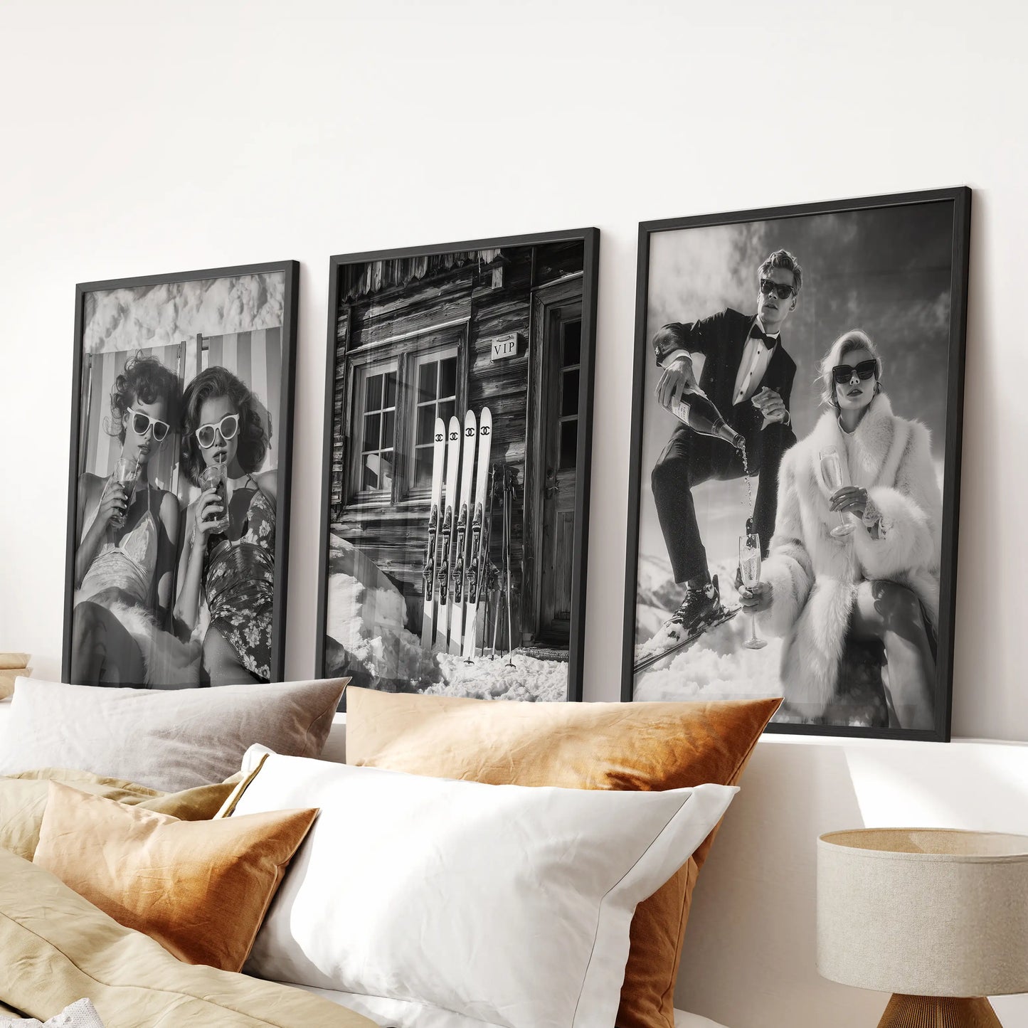 A 3-piece wall art set of vintage ski-lodge bar scenes in slim black frames centers above the bed, infusing the room with cozy winter charm.