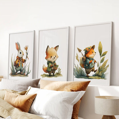 Watercolor woodland creatures 3-piece art print set in white frames hangs over the bed headboard for a bright, cozy bedroom focal point.
