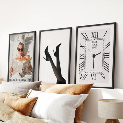 Femme fatale portrait art, a three-poster set in black frames, hangs over the headboard to bring magazine-glam wall art to the bedroom.