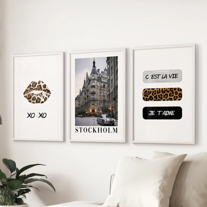 Glossy lips poster set of three adds playful glamour to the living room above the sofa, shown in crisp white frames for a bright, airy feel.